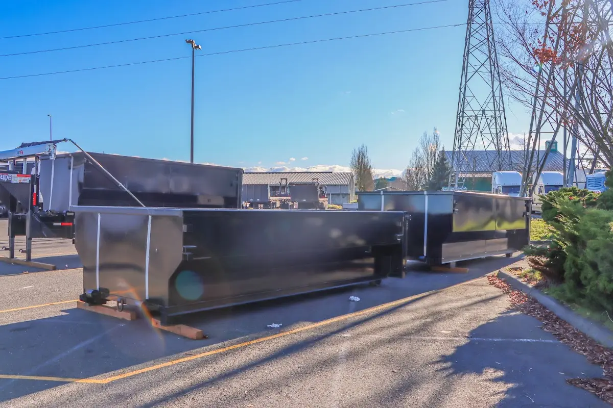 Roll-off dumpster ready for waste disposal at job site for 12 Yard Dumpster Rental in Weddington